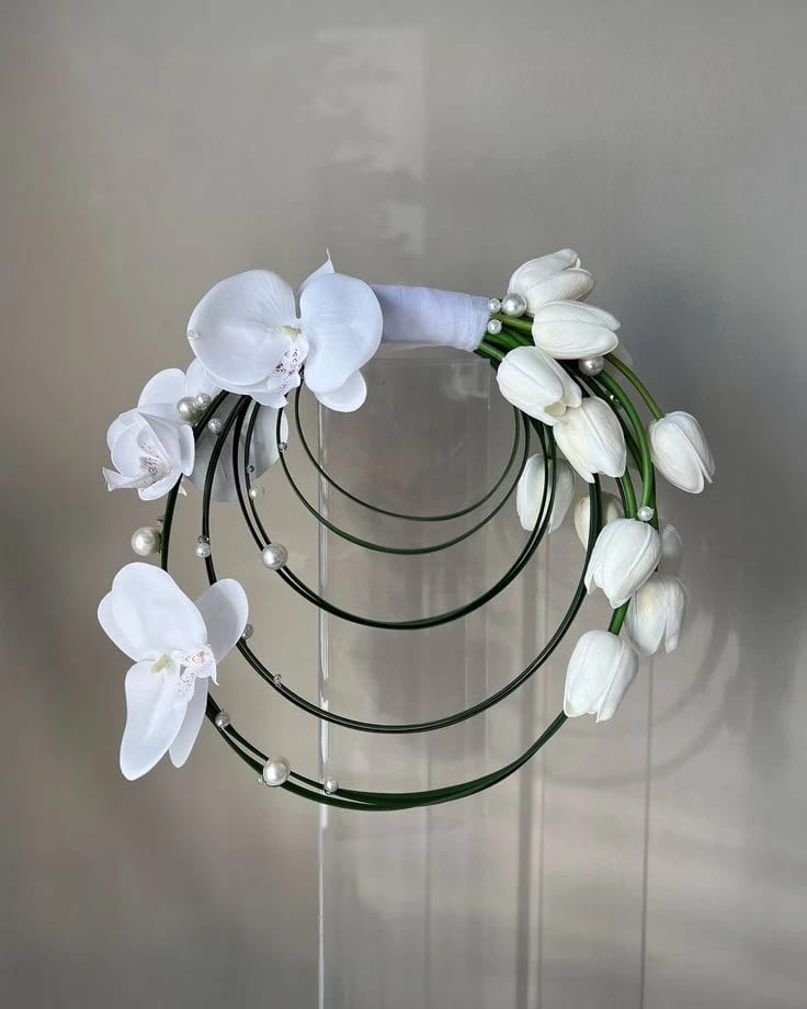 BRIDAL BOUQUET TULIP WHITE W/ PHALAENOPSIS/ROUND WITH GREEN STEEL GRASS - 1