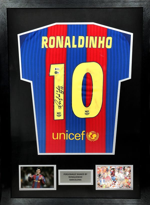 Ronaldinho Signed 2007/08bFC Barcelona Jersey- framed (BECKETT)