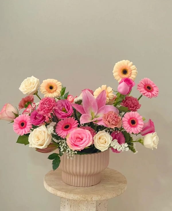vase with watermelon-colored flowers